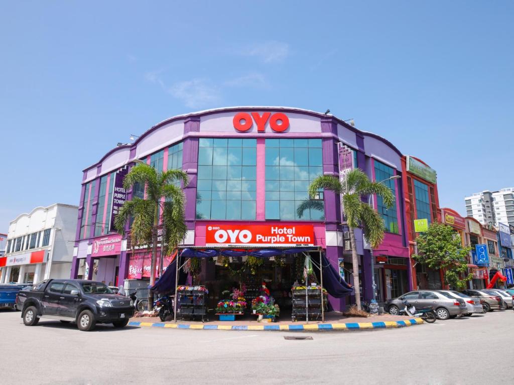 a building with a toyota dealership in a city at OYO 880 Hotel Purple Town in Sekinchan