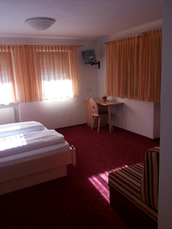 Postel nebo postele na pokoji v ubytování Hotel Laerchenhain
