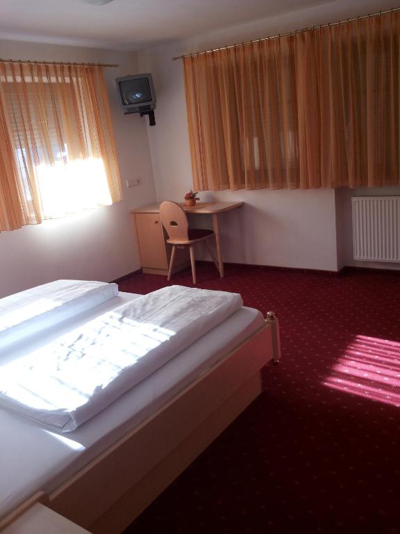 Postel nebo postele na pokoji v ubytování Hotel Laerchenhain
