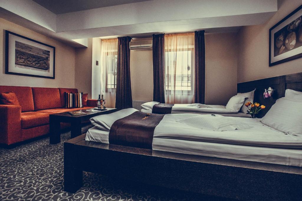 Postel nebo postele na pokoji v ubytování Hotel Cherica