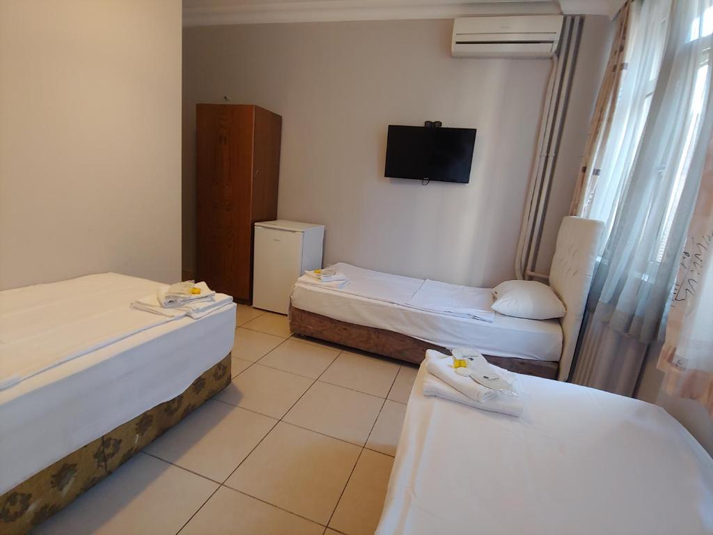 Postel nebo postele na pokoji v ubytování Hotel Yonca