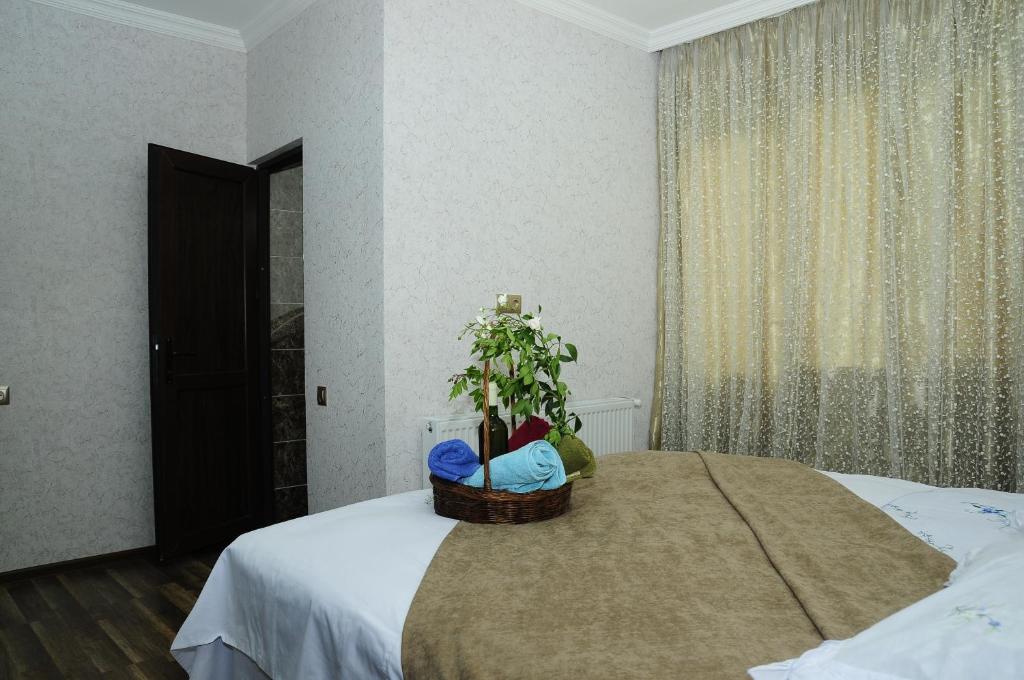 Postel nebo postele na pokoji v ubytování Guest House IVO