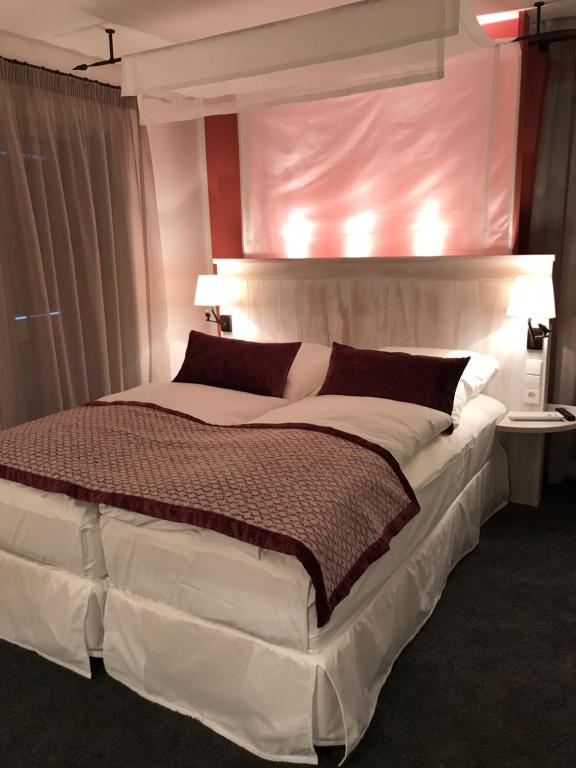 Postel nebo postele na pokoji v ubytování Altes Amtshaus, 3-Sterne Hotel Garni Superior