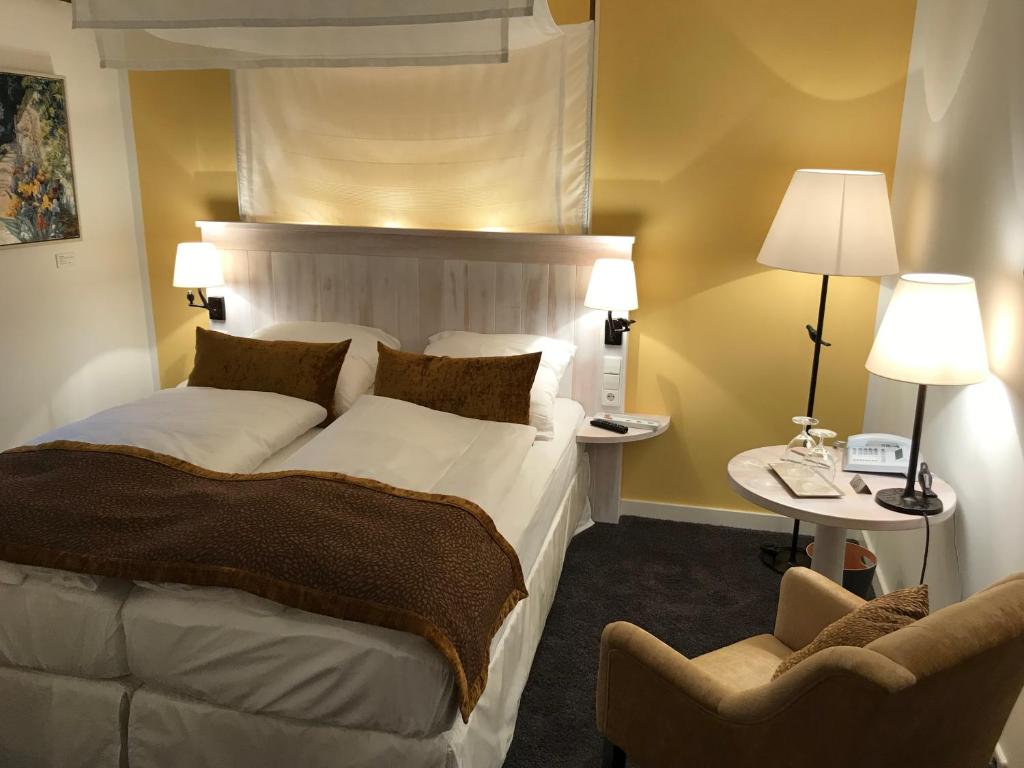 Postel nebo postele na pokoji v ubytování Altes Amtshaus, 3-Sterne Hotel Garni Superior