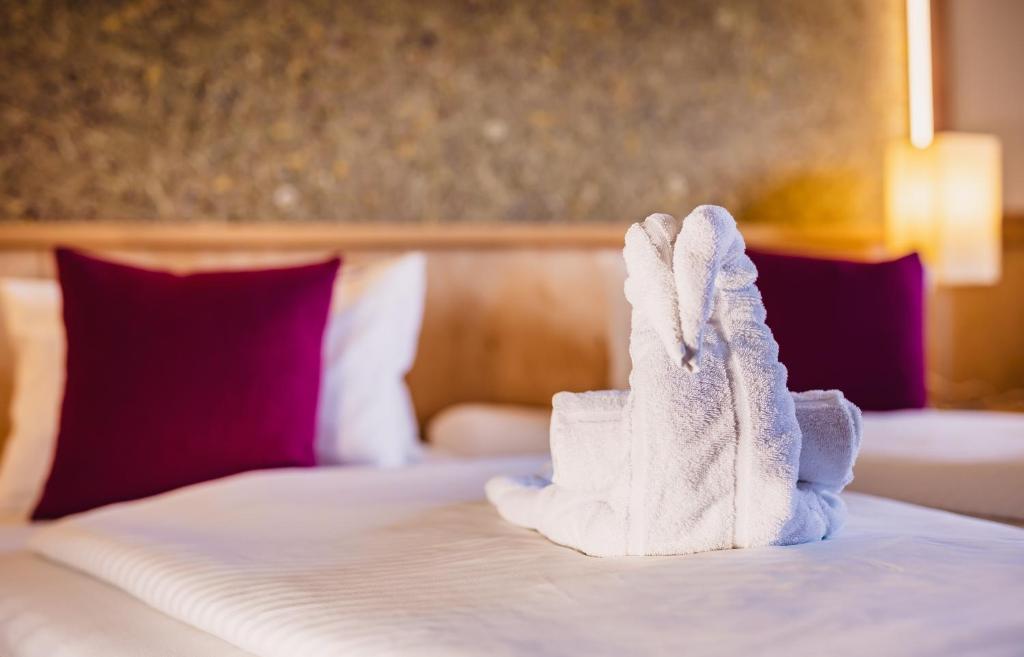 Posteľ alebo postele v izbe v ubytovaní Panorama Hotel Guggenbichl - inkl Sommerkarte, einmaliger Eintritt ins Tauern Spa & bester Ausblick über Kaprun