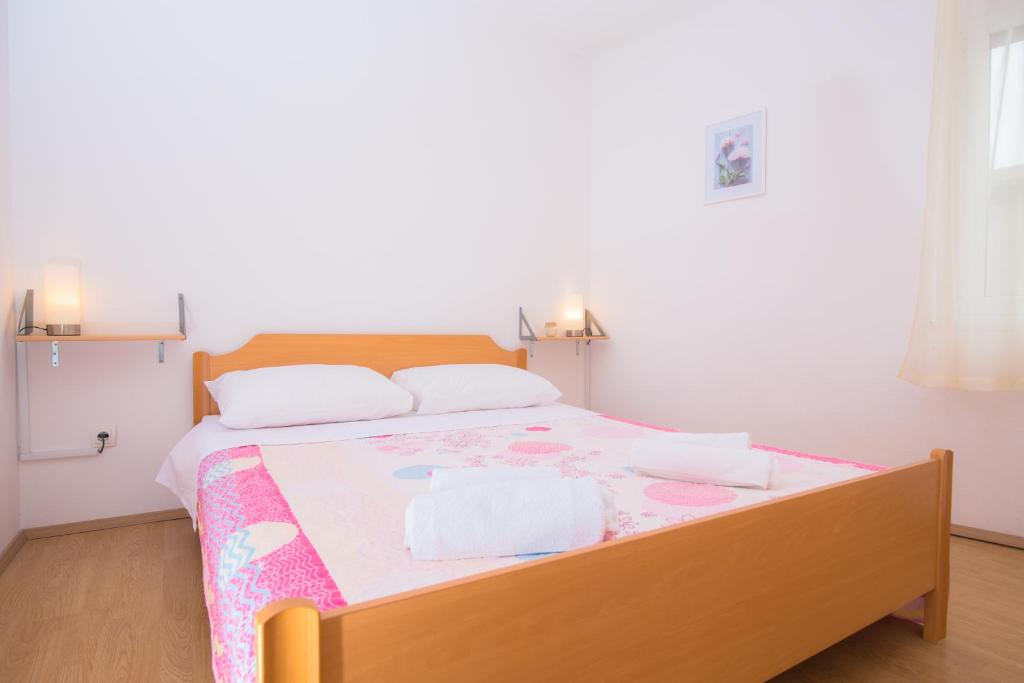 Postel nebo postele na pokoji v ubytování Apartment Rita