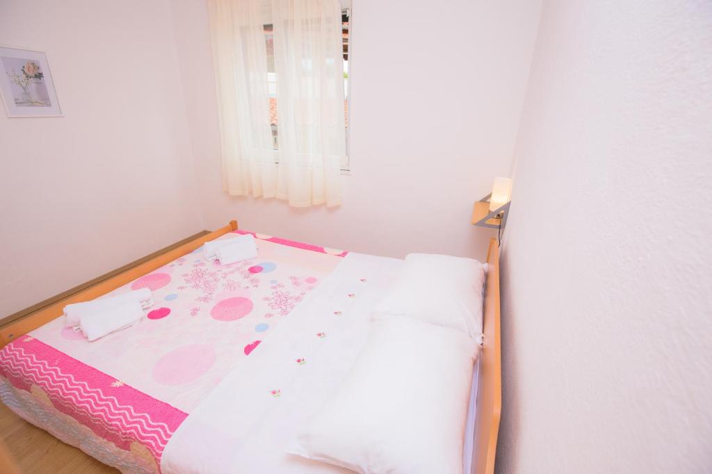 Postel nebo postele na pokoji v ubytování Apartment Rita