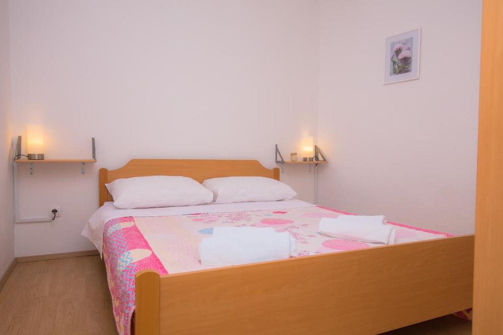 Postel nebo postele na pokoji v ubytování Apartment Rita