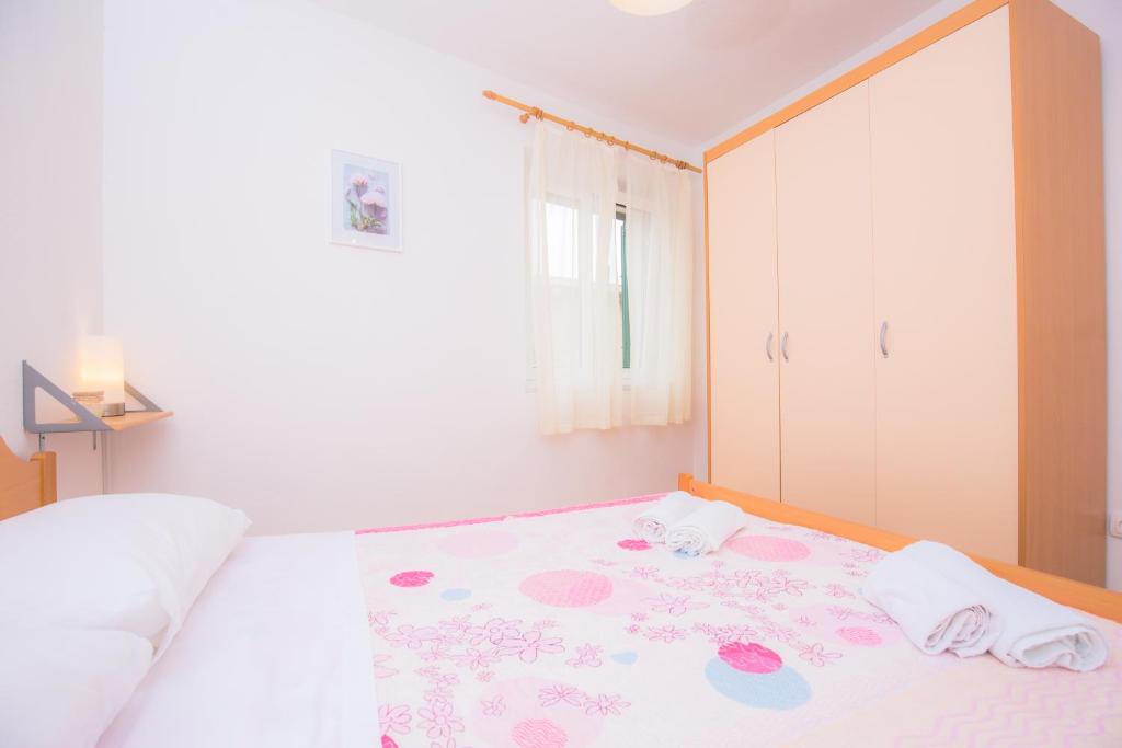 Postel nebo postele na pokoji v ubytování Apartment Rita