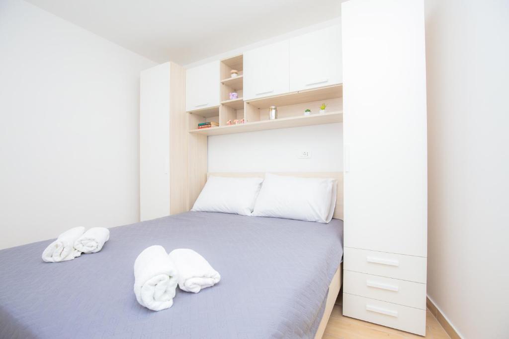 Postel nebo postele na pokoji v ubytování Apartment Rita