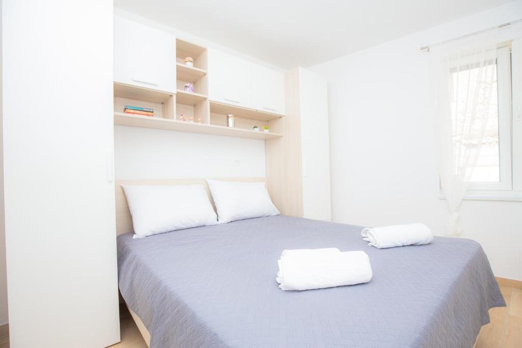 Postel nebo postele na pokoji v ubytování Apartment Rita