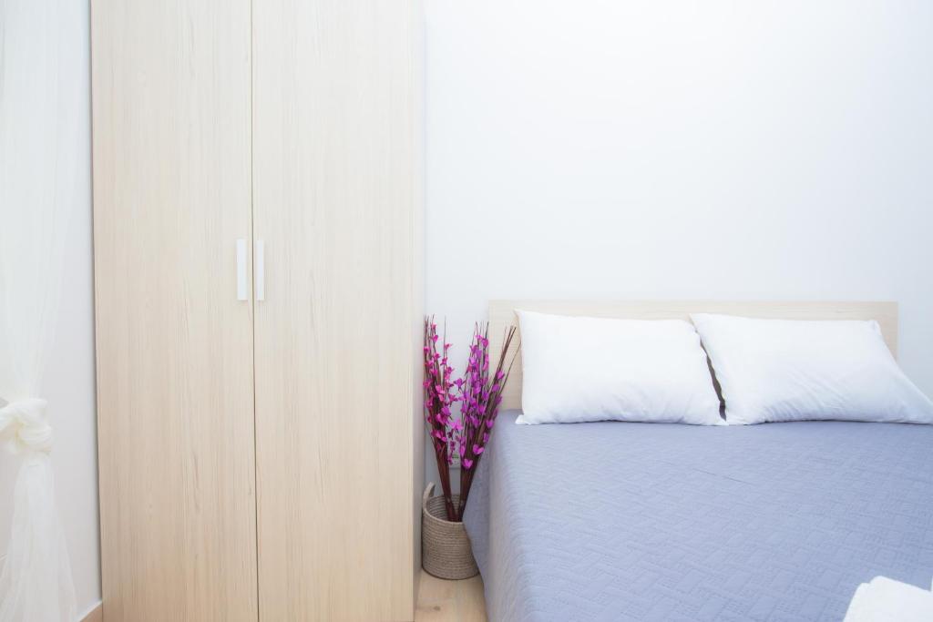 Postel nebo postele na pokoji v ubytování Apartment Rita