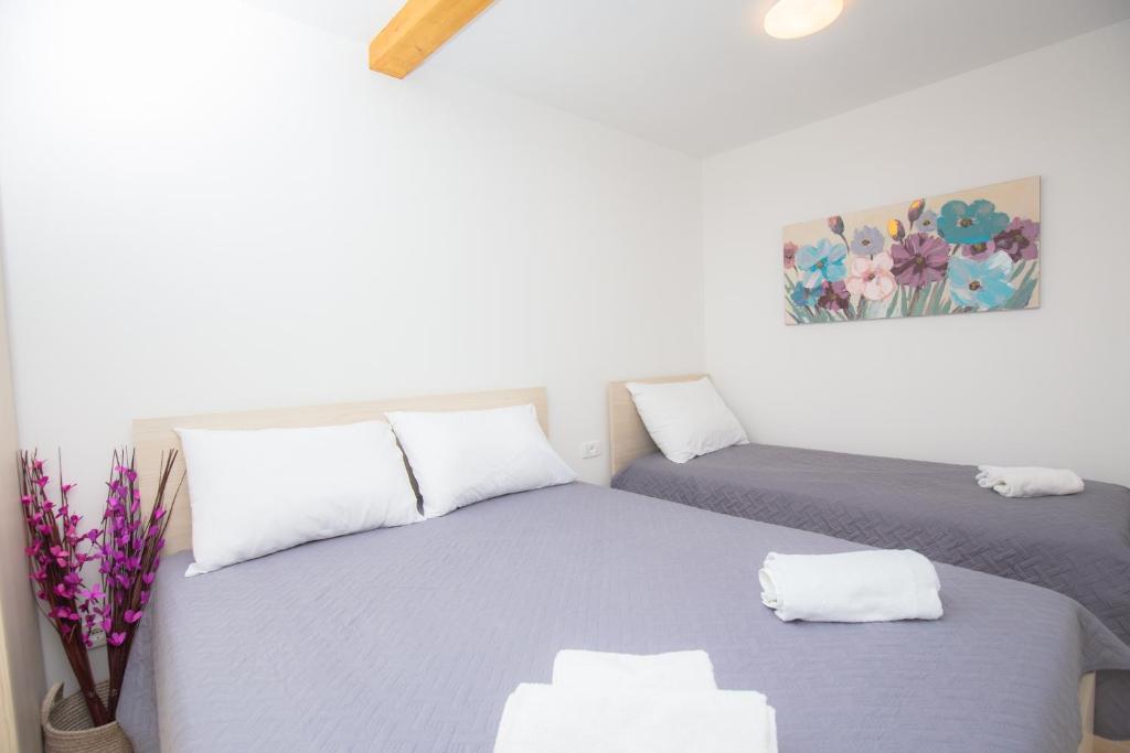 Postel nebo postele na pokoji v ubytování Apartment Rita