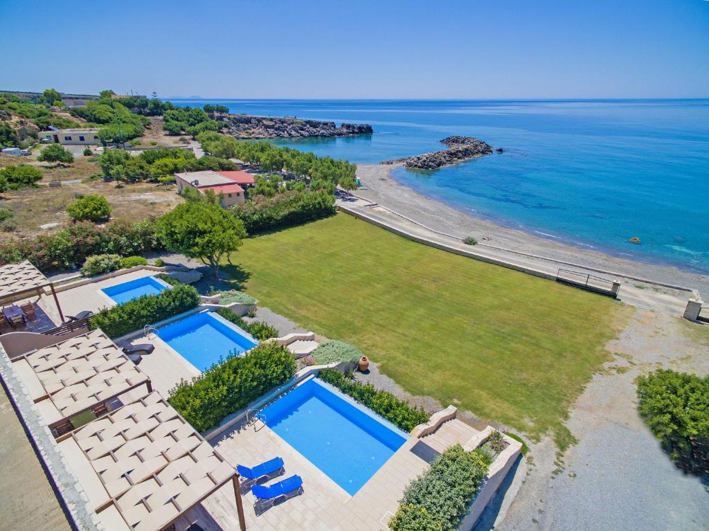 an aerial view of a villa with two swimming pools at Mary Beach in Rodakino
