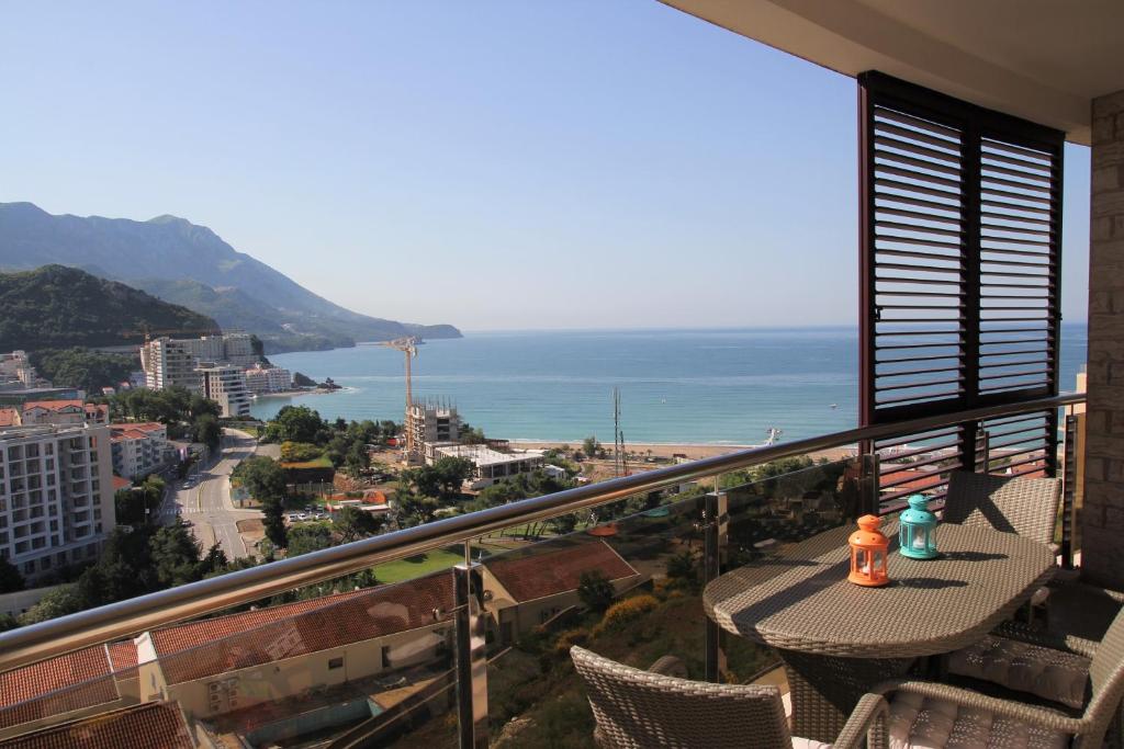 a balcony with a table and chairs and the ocean at Montenegro Diamonds in Becici