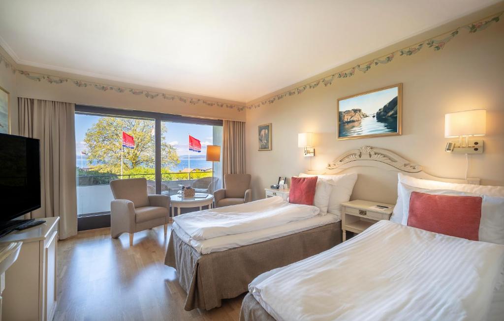 Postel nebo postele na pokoji v ubytování Hotel Refsnes Gods - by Classic Norway Hotels