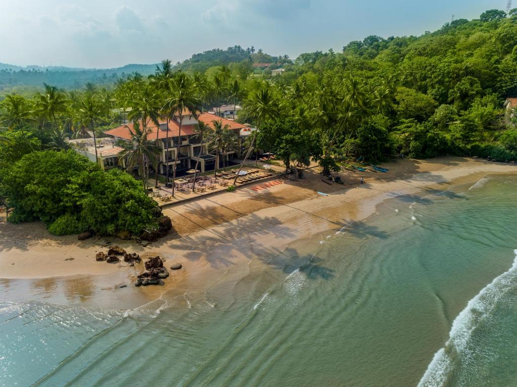 an aerial view of a beach with a resort at Cocobay Unawatuna in Unawatuna