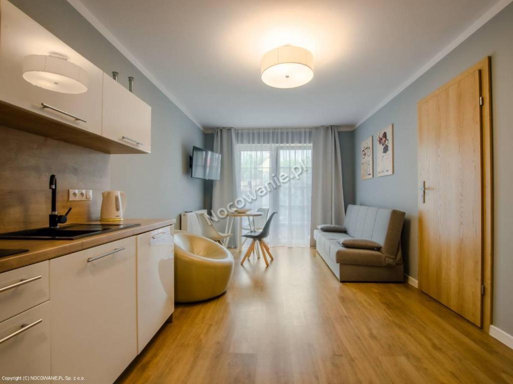 Kuchyň nebo kuchyňský kout v ubytování VILLA VARSOVIA ROWY
