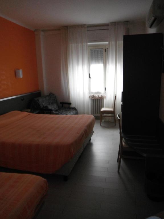 Postel nebo postele na pokoji v ubytování Hotel Renato