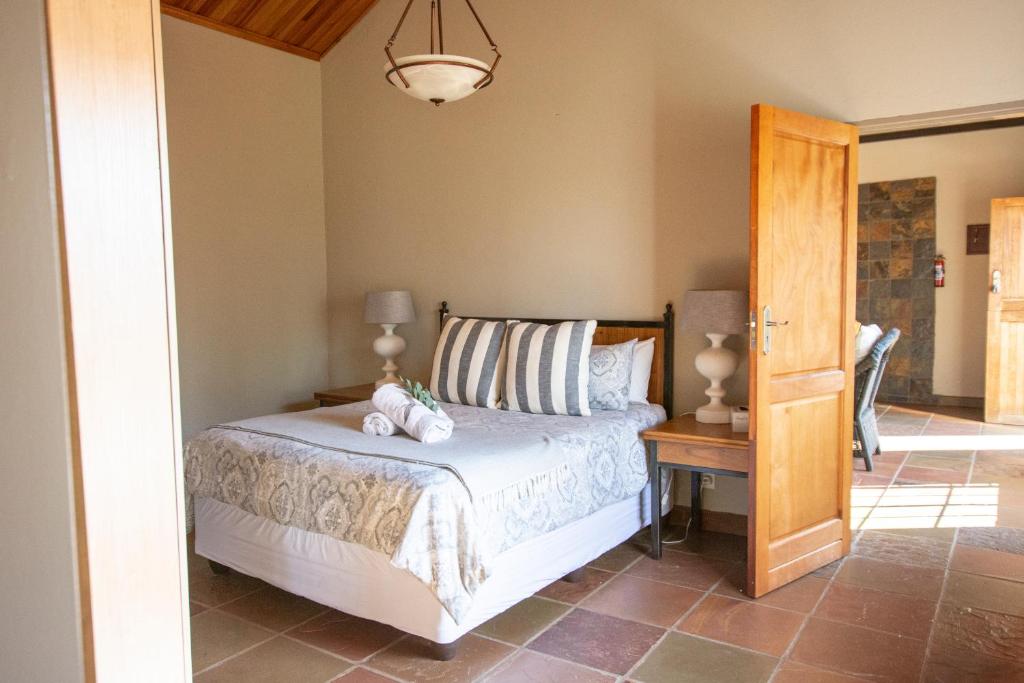 Postel nebo postele na pokoji v ubytování Milorho Lodge