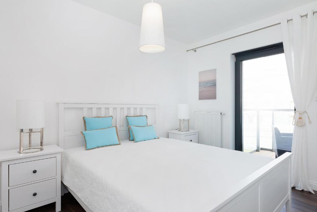 Posteľ alebo postele v izbe v ubytovaní Apartamenty Morska Fala-Gardenia