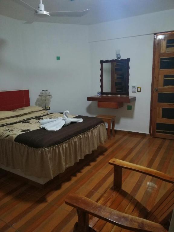 Postel nebo postele na pokoji v ubytování Casa CheJum Bacalar