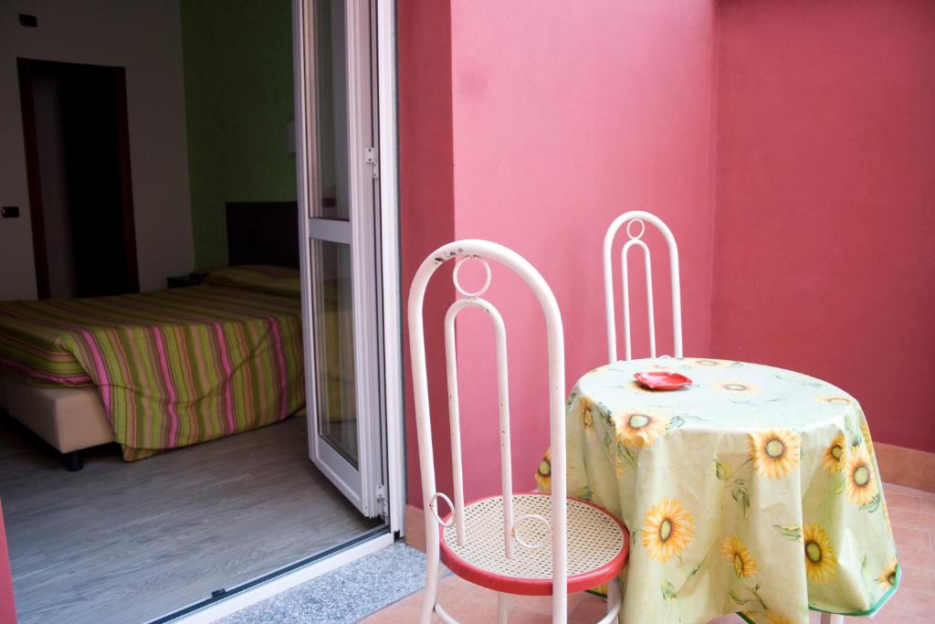 Postel nebo postele na pokoji v ubytování Hotel Renato