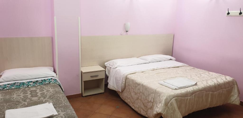 Postel nebo postele na pokoji v ubytování Agriturismo Piccolo Paradiso