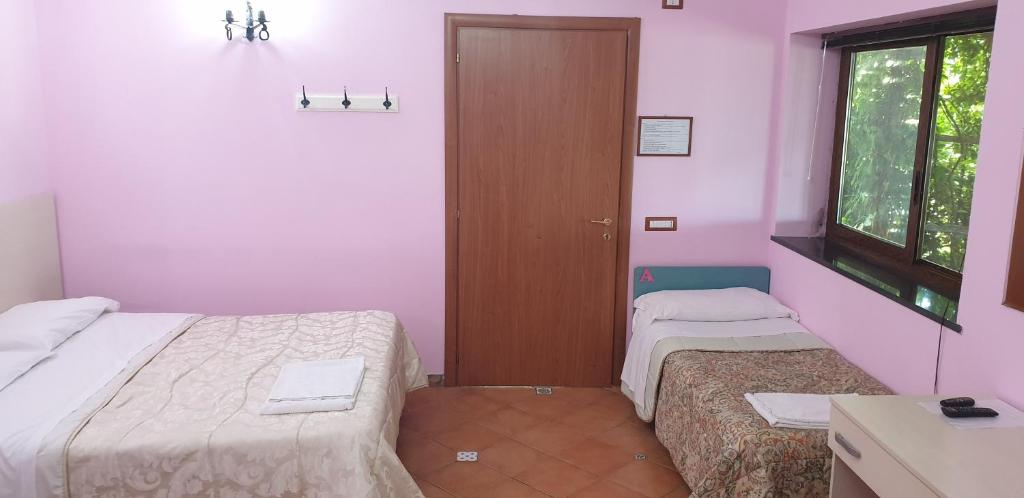 Postel nebo postele na pokoji v ubytování Agriturismo Piccolo Paradiso