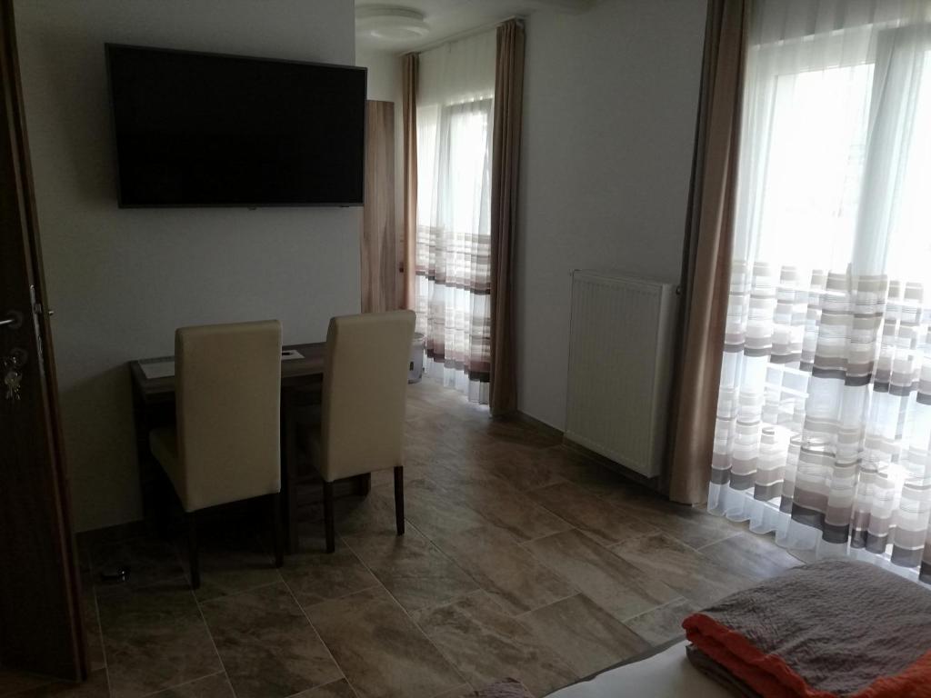 TV a/nebo společenská místnost v ubytování Haus Alexis