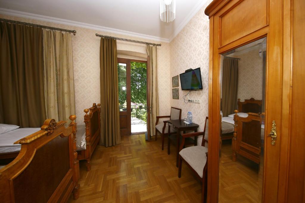 TV a/nebo společenská místnost v ubytování Bloom Boutique Hotel
