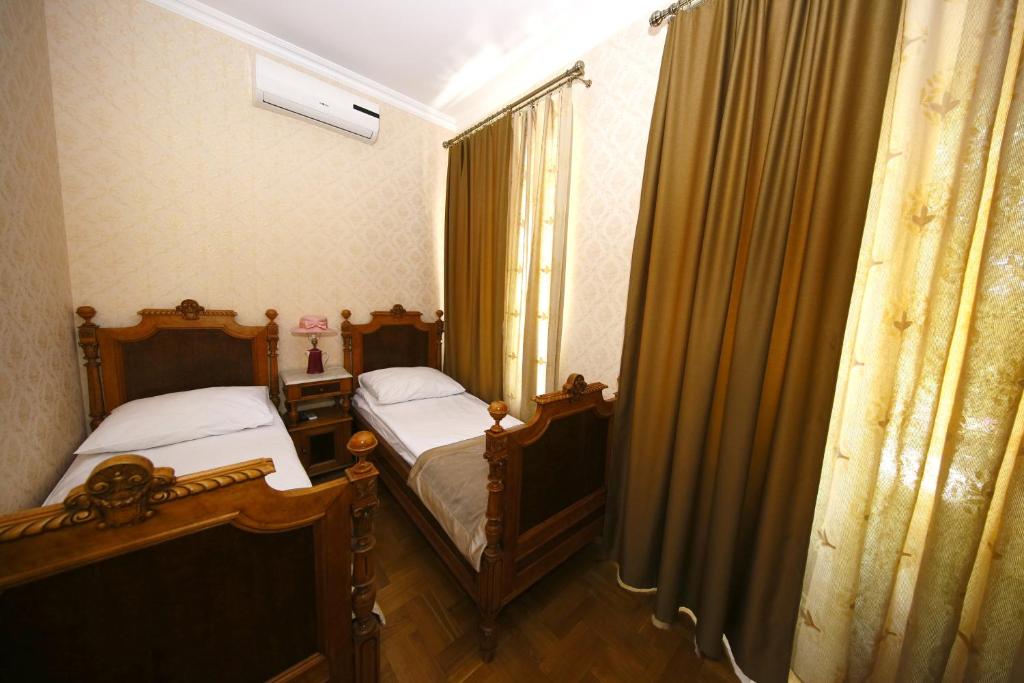 Postel nebo postele na pokoji v ubytování Bloom Boutique Hotel
