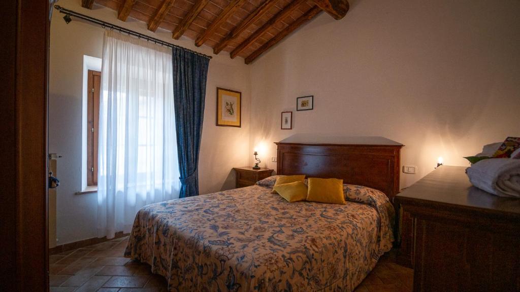 Voodi või voodid majutusasutuse Poggio Al Palio toas