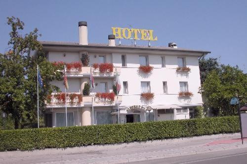 a building with a hotel sign on top of it at Hotel Al Sole in Preganziol