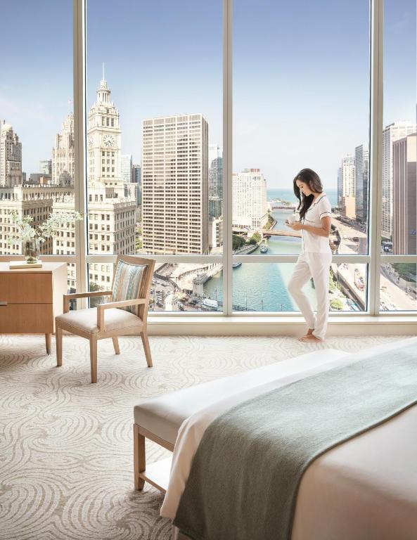 a woman standing in front of a window in a hotel room at Trump International Hotel & Tower Chicago in Chicago