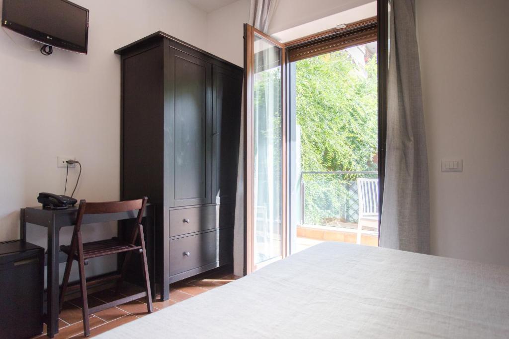 Postel nebo postele na pokoji v ubytování B&B Maria Rosaria