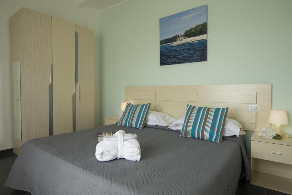 Postel nebo postele na pokoji v ubytování Hotel Spiaggia Marconi