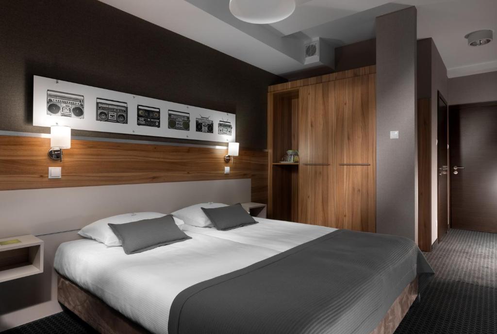 Postel nebo postele na pokoji v ubytování Hotel Beethoven