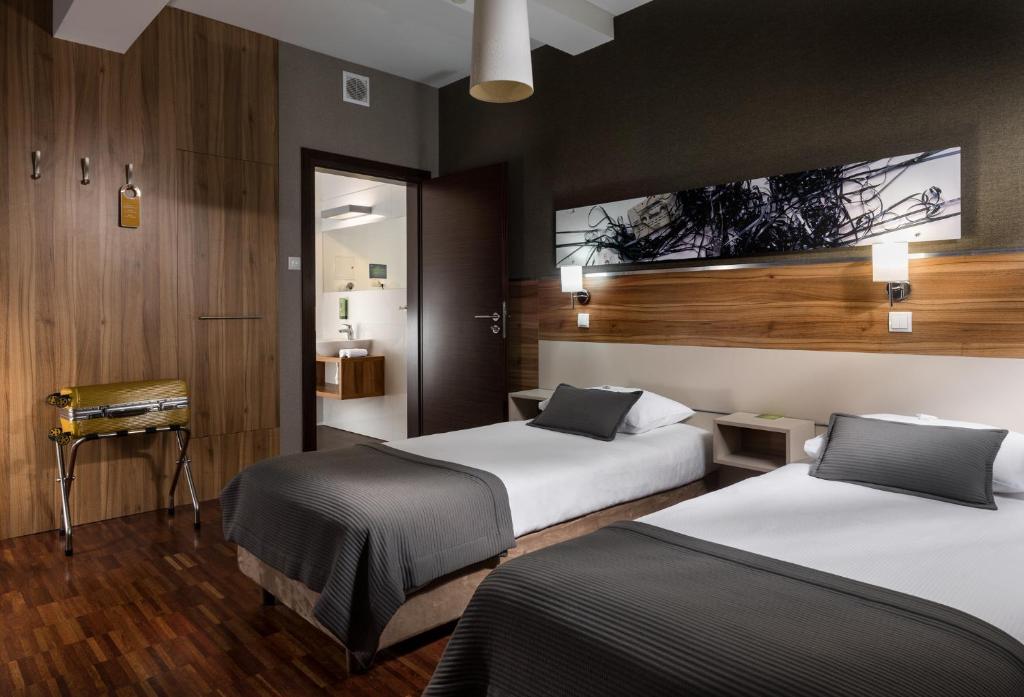 Postel nebo postele na pokoji v ubytování Hotel Beethoven
