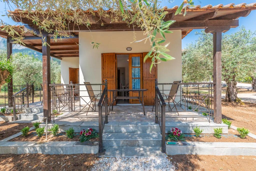 a home with a pathway leading to the front door at Lucia's Home in Skala Potamias