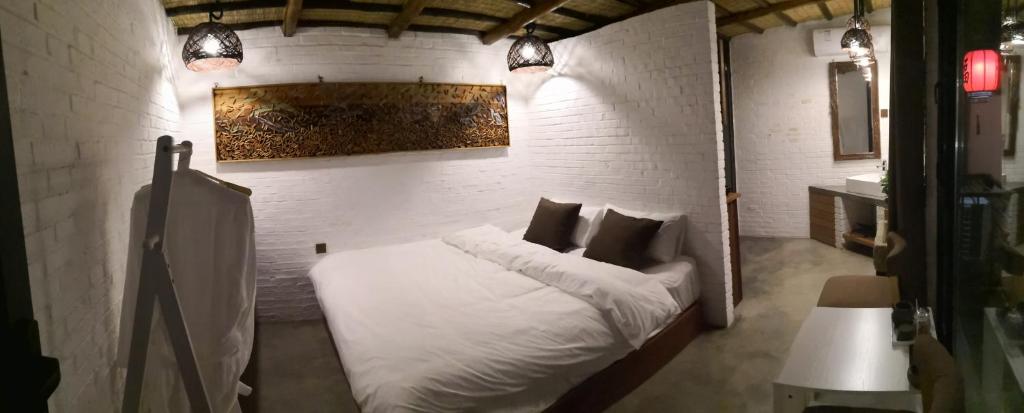 Postel nebo postele na pokoji v ubytování Guixu Huatang Homestay