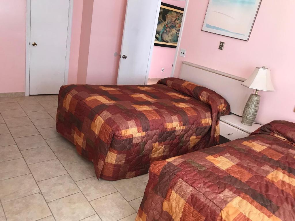 Postel nebo postele na pokoji v ubytování El Ray Motel