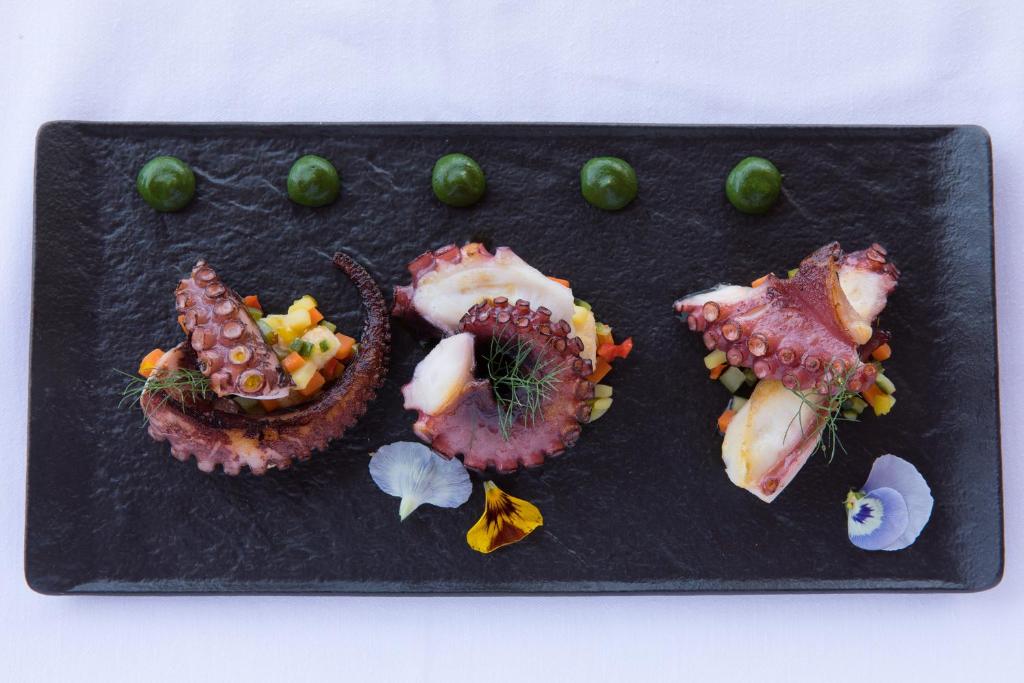 a plate of food with fruit and vegetables on it at Grand Hotel Ambasciatori in Sorrento