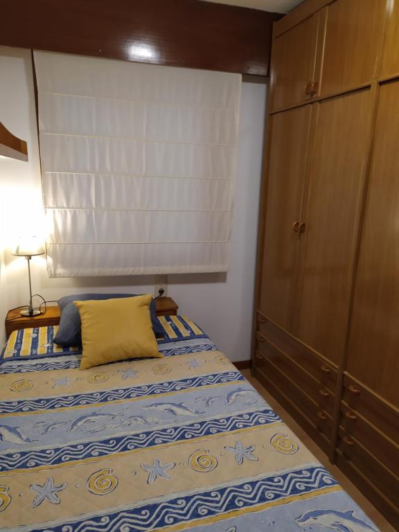 Postel nebo postele na pokoji v ubytování APARTAMENTO VILLA 3