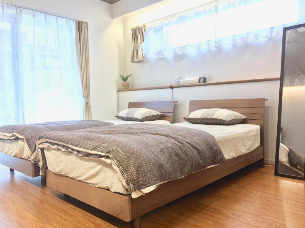 A bed or beds in a room at A-style Futenma / Vacation STAY 35875