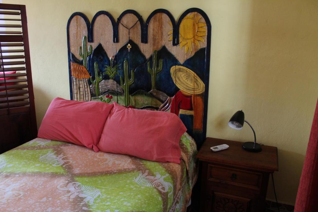 Postel nebo postele na pokoji v ubytování AH KIN Cancun Centro