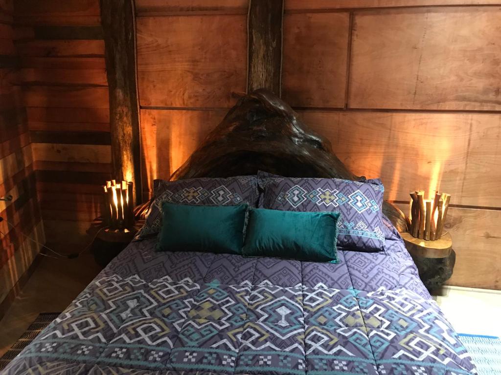 Voodi või voodid majutusasutuse Karkú Lodge toas
