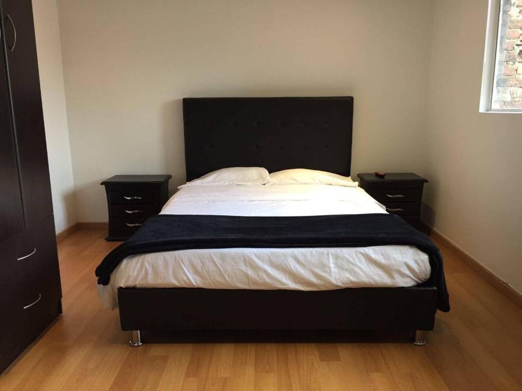 A bed or beds in a room at BEAUTIFUL APARTMENT NEAR CITY CENTRE. APTO 302