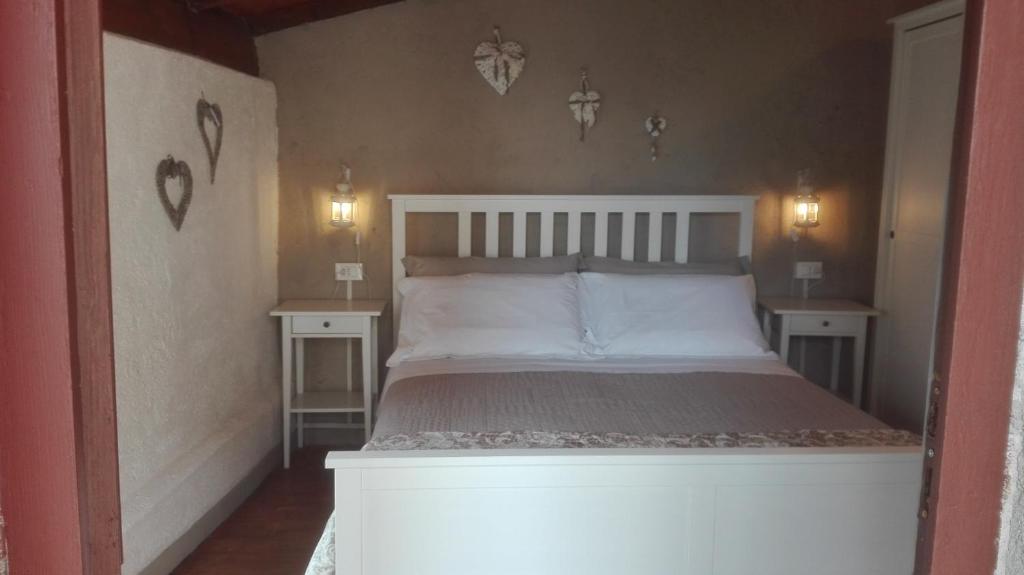 Postel nebo postele na pokoji v ubytování Agriturismo Nonnamelia
