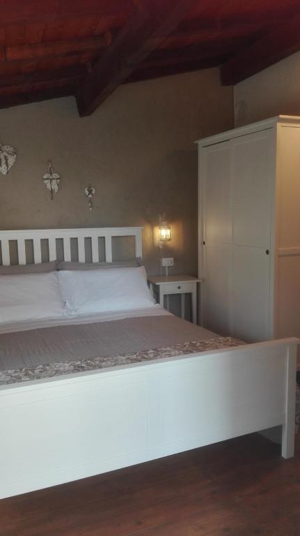 Postel nebo postele na pokoji v ubytování Agriturismo Nonnamelia